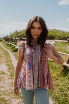 This top is cute, lightweight and perfect for summer! Mixed wallpaper print Waive smocked bodice Flutter sleeve top 65% rayon 35% polyester Model is 5'8" and wearing a size small. Small: 2-4 Medium: 6-8 Large: 10-12 Bohemian Tops With Ruffle Sleeves For Day Out, Bohemian Ruffle Tops For Day Out, Bohemian Ruffle Sleeve Tops For Day Out, Bohemian Ruffled Tops For Day Out, Multicolor Flowy Blouse With Flutter Sleeves, Feminine Smocked Top With Floral Print For Vacation, Feminine Floral Print Smocked Top For Summer, Feminine Summer Smocked Top With Floral Print, Feminine Floral Smocked Top For Summer