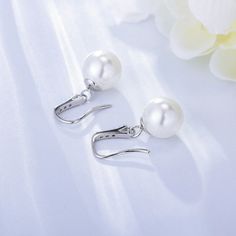 Looking for a pair of earrings that exude elegance and sophistication? Look these earrings feature high-quality, lustrous pearls that sit delicately on the ear, creating a refined and understated look that is perfect for any occasion. They are simple yet stylish, and designed to complement any outfit – from a formal gown to jeans and a t-shirt. Style: Women Metal Material: S925 Sterling Silver Pearl Type: Uncultured Pearl Color: White Pearl Shape: Round Earring Weight: 3.6g Earring Length:2.46cm Formal Pearl White Clip-on Earrings, Elegant Pearl Clip-on Earrings For Formal Occasions, Elegant Pearl Drop Clip-on Earrings, Elegant Pearl White Earrings With Pearl Drop, Elegant Pearl White Pearl Drop Earrings, Graceful Pearl White Pearl Earrings, Elegant Pearl White Earrings With Pearl Charm, Elegant White Clip-on Earrings With Pearl Charm, Elegant Pearl White Pearl Clip-on Earrings