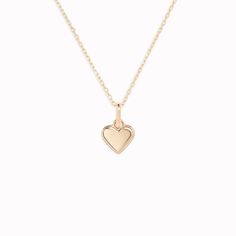 Our 14k yellow gold heart pendant charm features a dainty beaded border — perfect for everyday wear.

Can be worn alone on a chain or stacked with your other favourite Linjer charms to make an elegant personalized necklace.


Pendant size: 5mm x 5.6mm

Inner length of bail: 3.4mm

14k yellow gold 

Chain sold separately Heart Pendant Gold, Sustainable Jewelry, Yellow Gold Chain, Traditional Jewelry, Recycled Gold, Heart Of Gold, Personalized Necklace, Heart Jewelry, High Quality Jewelry