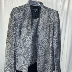 Brand New Never Worn Comes With Jacket, Top And Pants Fitted Metallic Blazer For Formal Occasions, Elegant Metallic Long Sleeve Blazer, Elegant Metallic Outerwear For Work, Metallic Fitted Outerwear For Formal Occasions, Metallic Fitted Formal Outerwear, Fitted Silver Blazer For Evening, Elegant Fitted Metallic Outerwear, Silver Fitted Elegant Suit, Elegant Fitted Silver Suit