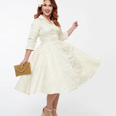 This Stunning 1950s Dress From Unique Vintage Is Crafted In A Dazzling Ivory Brocade Fabric And Is Accented With Gold Eyelets And A Collar. Complete With Button Front, Side Pockets And Full Swing Skirt! Shell: 65% Polyester, 35% Cotton; Lining: 95% Polyester, 5% Spandex Hand Wash Cold, Hang Dry Lined, Button Front Side Pockets Material Has No Stretch Uv Clothing, Unique Vintage Dresses, 80s Prom Dress, 1950s Outfits, Bridal Shower Outfit, Old Hollywood Glam, Gold Brocade, Brand Dress, Womens Vintage Dresses