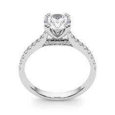 This elegant ring features 1/5 ctw. of dazzling diamonds that extend down the band. A 1.0 - 1.0 ct. round shape stone can be set with this ring.This ring can be customized for other stone sizes or shapes. Please contact us for assistance. Moissanite Diamond Ring With Pave Setting For Promise, Moissanite Diamond Ring With Diamond Accents, Timeless Diamond Ring With Round Band For Proposal, Moissanite Round Cut Diamond Ring With Accents, Moissanite Diamond Ring With Diamond Accents Round Cut, Timeless Round Band Diamond Ring For Proposal, Promise Diamond Halo Ring With Round Cut, Diamond Halo Ring For Promise With Round Cut, Diamond White Single Cut Diamond Wedding Ring For Proposal