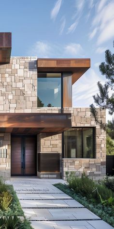 a modern house with stone and wood accents