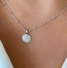 From our P.S. Collection, the P.S. Small Round Necklace is delicate frame of milgrain detail, with space for three custom engraved letters, like a cherished set of initials. Engraving is complimentary in your choice of font. Available with our suggested 18K Oval Link Chain or as a solo charm to curate into your everyday neck story. 18K Yellow Gold Charm 18K Yellow Gold Oval Link Chain Pendant Length: 10mm Chain length: 16" Classic Silver Engraved Necklace, Classic White Jewelry With Initials, Dainty White Gold Jewelry With Engraving Option, Refined Silver Necklace With Polished Finish, Elegant White Monogram Jewelry, Classic Oval Link Personalized Necklace, Silver Monogram Jewelry For Everyday, Everyday Silver Monogram Jewelry, Luxury Engraved White Gold Necklaces