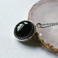 "** Photo insertion service is available for purchase with this locket here: https://www.etsy.com/uk/listing/1267233980/locket-photo-service-add-photo-for-your?click_key=1aa4d8030962c3980bfaa35f7176c9a3e7aed283%3A1267233980&click_sum=35b9b58d&ref=shop_home_active_1&frs=1&cns=1 Tracked shipping is used for ALL orders including international orders. International customers are able to track your orders online and be assured that it will arrive safely and everything is covered.* **Note: this is a p Black Engraved Necklace For Wedding, Black Spiritual Locket Jewelry, Spiritual Black Locket Jewelry, Black Spiritual Jewelry With Locket, Oval Black Enamel Jewelry Gift, Black Gemstone Necklace For Wedding, Black Cabochon Wedding Jewelry, Black Cabochon Jewelry For Wedding, Oval Black Birthstone Jewelry