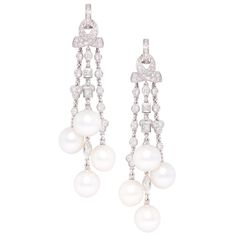 The diamond and pearl chandelier earrings feature a cascade with 8 South Sea pearls of 11mm diameter. The untreated South Sea pearls originate from the waters of Northwestern Australia. They display a beautiful nacre and their natural color and high luster have not been enhanced in any way. The design is complete with 4.94 carat of diamonds of different cuts (round, marquise, square) of top quality (color, clarity and cut, F-G/VVS). The earrings are one-of-a-kind and entirely handmade in 18 cara Tassel Chandelier, Pearl Chandelier Earrings, Diamond Chandelier Earrings, Pearl Chandelier, Gold Chandelier Earrings, Earrings Chandelier, South Sea Pearls, Sea Pearls, Women Diamond