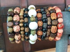 WE HAVE A TON OF OTHER WOOD BEAD BRACELETS!  CLICK BELOW TO SEE ALL STYLES. https://www.etsy.com/shop/BeautifulByTheBauers?ref=shop-header-name&listing_id=1563599230&section_id=44879093 Check out the rest of our Etsy shop : ) One size fits most adults and big kiddos. Worried about needing needing a smaller or bigger size? Just send me a message! Discover the essence of Bohemian elegance with our Handmade Boho Style Wood Bead Bracelets. Crafted with care and creativity, each of these bracelets is Cheap Colorful Beaded Brown Jewelry, Cheap Wooden Beaded Bracelets For Meditation, Cheap Artsy Jewelry With Round Beads, Traditional Beaded Bracelets At Cheap Price, Cheap Vintage Beaded Bracelets For Festival, Affordable Traditional Beaded Bracelets For Festivals, Luxury Multicolor Wooden Beads Jewelry, Affordable Brown Jewelry With Colorful Beads, Cheap Hippie Style Bracelet