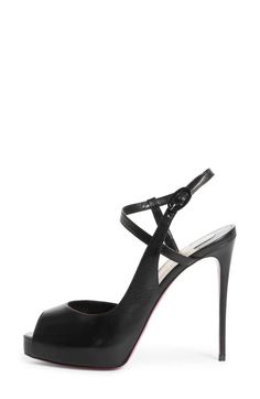 "Find CHRISTIAN LOUBOUTIN Jenlove Ankle Strap Peep Toe Stiletto on Editorialist. A sky-high heel and strappy peep-toe design amp up the daring allure of this sleek leather sandal. 4 3/4\" (121mm) heel (size 8.5US/38.5EU) Adjustable strap with buckle closure Wipe with a soft, dry cloth and store in a dust bag Please note the red lacquer on soles will wear off as a result of normal use. To minimize the effect, avoid wearing in wet weather or on abrasive surfaces Leather upper, lining and sole Made in Italy Women's Designer Shoes" Luxury Leather T-strap Open Toe Sandals, Designer Open Toe T-strap Sandals With Leather Sole, Christian Louboutin Strappy Heels, Designer Spiked Open-toe Heels, Black T-strap Sandals With Leather Sole And Open Toe, Red Lacquer, Wet Weather, Sky High, Footwear Design Women