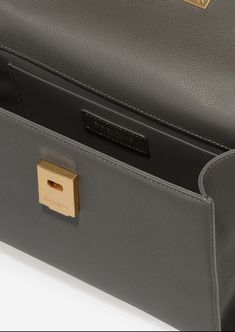 Inspired by Grace Kelly's enduring style, the Grace Top Handle Bag is meticulously crafted from premium USA full-grain textured calfskin leather, ensuring both durability and elegance. Its timeless and versatile design features a thoughtfully structured interior that comfortably accommodates all your everyday essentials. Whether day or night, you'll find yourself instinctively reaching for this chic and easy-to-wear masterpiece. Parisa Wang, Grain Texture, By Grace, The Grace, Grace Kelly, Handle Bag, Everyday Essentials, Top Handle, Best Sellers