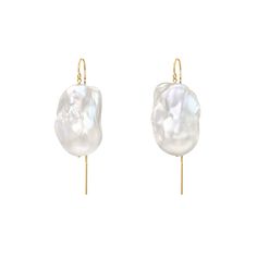 ~ New for #FW1920 ~ XXL Runway Sized Baroque Pearl Earrings ~ Enormous beautifully matched natural white baroque freshwater pearl drop earrings. These pearls in the pair below are approx 1.5 inches / 3.8 cm long and 7/8 of an inch / 2 cm wide. ~ 2 and1/4 inch / 7.1 cm threaded gold filled earring base. _ Very high luster and quality these are made to order and any of the earring bases used by Jean Joaillerie can be chosen for your pair. ~ Limited Edition. ~ Each pair will vary due to the unique Gold Thread Earrings, Pearl Threader Earrings, Pearl Lariat Necklace, Freshwater Pearl Drop Earrings, Gold Baroque, Baroque Pearl Earrings, Gold Statement Necklace, Freshwater Pearls Earrings, Contemporary Luxury