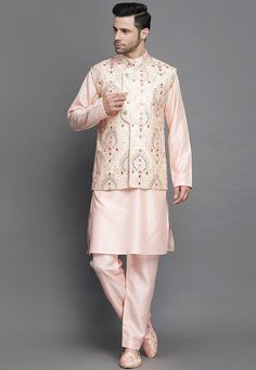 Art Silk Kurta in PeachThis Readymade attire is Enhanced with Mirror Effect and Resham Work. Crafted in Chinese Collar Neck and Full SleeveAvailable with an Art Silk Pajama in Peach and an Art Silk Nehru Jacket in PinkDo note: Brooch and Footwear shown in the image is for presentation purposes only. Half to one inch may vary in measurement. (Slight variation in actual color vs. image is possible) We sell all kinds of menswear. Mens Kurta | Mens Kurta Pajama | Mens Sherwani | Mens Sherwani Sets | Spring Nehru Jacket With Resham Embroidery, Traditional Long Sleeve Pink Bandhgala, Traditional Pink Long Sleeve Bandhgala, Pink Long Sleeve Traditional Wear With Chikankari Embroidery, Spring Embroidered Bandhgala With Traditional Drape, Spring Embroidered Traditional Bandhgala, Pink Bollywood Sherwani With Floral Embroidery, Pink Nehru Jacket With Resham Embroidery, Pink Nehru Jacket With Zari Work For Spring