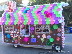 a food truck decorated with balloons and candy