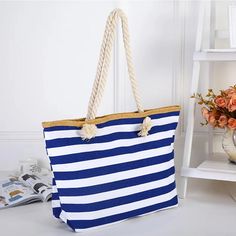 Stay Stylish and Organized with This Versatile Tote Make your summer days effortless with the Women’s Large Striped Beach Tote Shoulder Bag. Whether you're heading to the beach, taking a shopping spree, or embarking on a travel adventure, this bag is your ultimate companion. Its spacious interior accommodates all your essentials, while the soft yet durable canvas exterior makes it lightweight and comfortable to carry. With an eye-catching striped pattern in a variety of vibrant colors—red, navy, rose red, and black—this tote adds a fashionable flair to any outfit. Why Choose This Tote? Handbag & Crossbody Bag: Adjustable for either shoulder or crossbody wear to suit your style and comfort. High-Quality Materials: Crafted from sturdy canvas with a polyester lining, it's designed to handle d Beach Accessories, Woman Beach, Beach Tote, Canvas Shoulder Bag, Primavera Estate, Beach Bag, Shoulder Bag Women, Tote Handbags, Canvas Tote