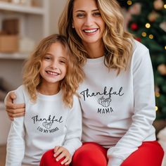 Thankful Mama! Introducing our Thankful Mama Sweatshirt - a cozy, heartwarming tribute to the incredible bond between mothers and their children. This soft, stylish sweatshirt is the perfect way for a son to show his appreciation, and when paired with our matching 'Thankful for my Mama' Son Sweatshirt, it becomes a touching duo that celebrates the love, support, and gratitude shared between a mother and her son. Wear these together and let the world know just how much you cherish your mom. To or Family Matching Fall Sweatshirt, Family Matching Sweatshirt For Fall, White Long Sleeve Matching T-shirt, Family Matching White Long Sleeve Sweatshirt, White Long Sleeve Family Matching Sweatshirt, White Long Sleeve Sweatshirt For Family Matching, White Long Sleeve Tops For Family Occasions, Matching Long Sleeve Tops For Mother's Day, White Long Sleeve Top For Gift