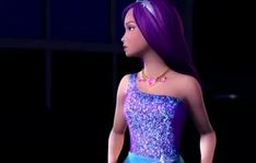 the doll is wearing a purple and blue dress with sequins on it's shoulders