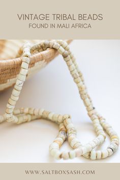 Beautifully aged, very old strand of white beads found in Mali Africa, called 'Green Heart' beads, made sometime between 1400 and 1800s in Murano, Venice. #homedecor #fairtrade #decorbeads #vintage Bohemian White Necklaces With Oval Beads, Bohemian White Necklace With Oval Beads, Bohemian White Oval Beaded Necklaces, Spiritual Hand-strung Heishi Beads, White Bohemian Necklace With Oval Beads, Hand-strung Spiritual Heishi Beads, Traditional White Necklace For Healing, Traditional Heart Beads For Jewelry Making, White Jewelry With Oval Wooden Beads