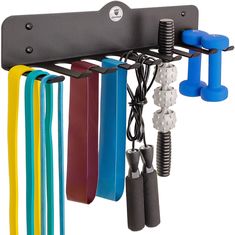 a wall mounted rack with several different colored handles