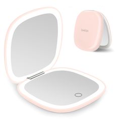 an image of a pink mirror with its reflection in it's side and the lid open