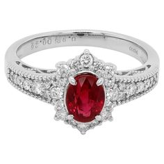 A JGGL Certified Burmese Ruby weighing around 1 carat is set along with 0.26 carat of white brilliant round diamond. The ring is made in PT 900 and has been manufactured in Japan. The image of the certificate can be found along with the images of the ring. The details of the diamond are mentioned below: Color: D Clarity: Vvs 14k White Gold Ruby Ring With Halo Setting, Oval Ruby Ring With Diamond Center Stone, Fine Jewelry Ruby Ring With Round Cut Diamond, Elegant Ruby Ring With Diamond In Round Cut, Brilliant Cut Diamond Ruby Ring, Elegant Ruby Ring With Diamond Round Cut, Ruby Ring With Brilliant Cut Diamond, Elegant Platinum Ruby Ring With Round Cut, Brilliant Cut Ruby Ring With Diamonds