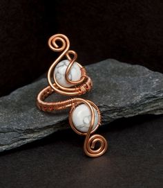 Boho copper ring.This ring is made of 1.25 mm copper wire wrapped with  8mm White Howlite gray veining Coin .This ring are basically adjustable ,Custom sizing can be done to ensure a comfortable fit for larger ,medium or small rings.These items comes packaged in a small rings boxes ready for gifts giving.If you have any questions about it, please do not hesitate to ask. Thank youImage may look different (color) due to many monitor or device resolutions. Wired Rings, Hippy Jewelry, Howlite Rings, Pyrite Ring, Wire Jewelry Rings, Rings Boho, Wire Wrap Jewelry Designs, Wire Wrapped Jewelry Tutorials, Arm Cuffs