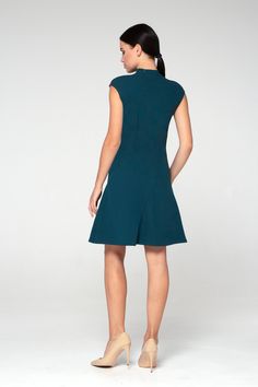 "Simple but elegant asymmetrical green cocktail dress in asian style is easy to wear for any party! - Chinese (modern cheongsam) style - Stand collar (mandarin) - Short cap sleeves - Skater pleated skirt - A-Line fitted silhouette - Hidden zipper on the back - Above the knee length (midi) Fiber: 40% viscose, 55% polyester, 5% elastan Color: green For size S: length- 34\" (86 cm) Our model wears size S (US 8) and is 171cm/5'6\" tall. You may feel free choosing the size. Just send us your measurem Solid Asymmetrical Midi Dress For Cocktail, Asymmetrical Solid Cocktail Midi Dress, Asymmetrical Solid Color Cocktail Midi Dress, Asymmetrical Cocktail Midi Dress, Elegant Green A-line Sleeveless Dress, Fitted A-line Asymmetrical Dress For Cocktail, Solid Cocktail Dress With Asymmetrical Hem, Elegant Fitted Asymmetrical A-line Dress, Elegant Fitted A-line Asymmetrical Dress