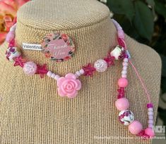 This beautiful pink beaded necklace set is perfect for adding a touch of girly glam to any outfit. The set includes a long necklace with a variety of pink beads, including pink glass beads, pink acrylic beads, and pink seed beads. A sparkling pink star charm and a delicate rose charm add a touch of whimsy to the design. The necklace is finished with a lobster clasp closure. The set also includes a shorter necklace with pink beads and a magnetic clasp closure. Beaded Necklace And Bracelet, Pink Beaded Necklace, Necklace And Bracelet Set, Pink Star, Pink Acrylic, Pink Acrylics, Necklace And Bracelet, Pink Stars, Pink Beads