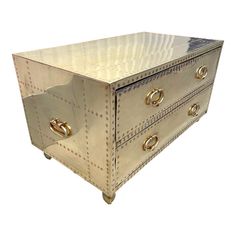 a metal box with two drawers on one side and three knobs on the other