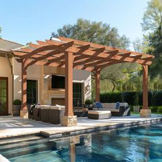 an outdoor living area next to a swimming pool