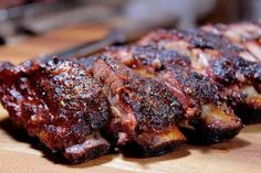 some ribs are sitting on a cutting board