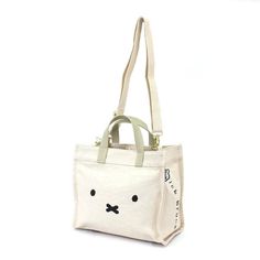 This Miffy stylish tote bag is the perfect accessory for everyday use. The Miffy Face design is bright and eye-catching, and it features a removable shoulder strap and inner pockets for securely carrying all your essentials. Its magnetic closure ensures the bag stays securely closed. DESCRIPTIONS - Color: Cream - Cotton- Size: approx. 11.02"w x 9.45"h x 5.51"d (excluding handle) Miffy Bag, Miffy Backpack, Miffy Merch, Miffy Tote Bag, Miffy Accessories, Miffy Products, Miffy Coin Pouch, Convertible Tote Bag, Stylish Tote Bag