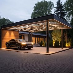 a black sports car parked in front of a house at night with its lights on