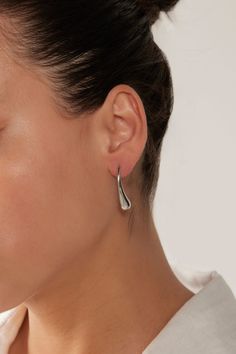 STYLE DETAILS: The Halcyon Drop Earring brings a refined addition to your accessories collection. Sleek, elongated droplets are secured with a stud closure and finished with stainless steel or gold plating. These earrings are ideal for days when you want a chic and understated look with minimal effort. FEATURES: Drop design Stud closure Gold Plated, Stainless Steel 3cm length Modern Metal Drop Earrings For Pierced Ears, Modern Metal Teardrop Earrings For Pierced Ears, Elegant Metal Dangle Drop Earrings, Modern Metal Teardrop Earrings For Formal Occasions, Modern Pierced Teardrop Earrings For Formal Events, Sleek Metal Drop Earrings, Modern Hypoallergenic Drop Jewelry, Elegant Metal Drop Earrings, Modern Formal Dangle Drop Earrings