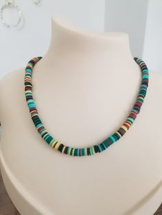 Looking for a stunning and unique accessory to complement your summer beach look? This Surfer Necklace with Colorful Heishi Beads is perfect for you! This handmade necklace features an adjustable length of 45-49 cm, allowing you to wear it at the perfect length for your neckline. The necklace is lightweight, weighing just 15 grams, making it easy to wear all day long without feeling heavy or uncomfortable. The necklace is made with colorful heishi beads and pastel African vinyl disc beads, giving it a vibrant and playful look that's perfect for a boho, beachy style. The polymer clay charm adds an extra touch of uniqueness and charm to this already stunning necklace. This necklace is a great gift for surfers, beach-goers, or anyone who loves to add a pop of color and style to their outfit. Cheap Green Necklace With Heishi Beads, Bohemian Spacer Beads Necklace For Vacation, Bohemian Beach Necklace With Spacer Beads, Bohemian Necklace With Spacer Beads For Beach, Bohemian Beaded Necklaces With Spacer Beads For Vacation, Bohemian Beaded Necklace For Vacation, Summer Beach Beaded Necklaces With Spacer Beads, Summer Beach Beaded Necklace With Spacer Beads, Colorful Beaded Jewelry For Vacation