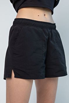 Take your activewear game to the next level with The Rae Taslan Shorts! Whether you're hitting the gym or just running errands, these shorts are perfect for any occasion. With a comfy elastic waistband, spacious pockets, and stylish side slits, you'll look and feel fabulous in the lightweight, breathable nylon fabric. So what are you waiting for? Slip into The Rae Taslan Shorts for an unbeatable look and a comfortable fit! High-waisted Relaxed Fit Athletic Shorts, High-waisted Relaxed Fit Athletic Shorts For Athleisure, Relaxed High-waisted Athletic Shorts For Athleisure, Athleisure High-waisted Athletic Shorts Relaxed Fit, Relaxed Fit Athletic Shorts With Built-in Shorts, Athleisure Relaxed Fit Running Shorts, Relaxed Fit Athletic Shorts With Built-in Shorts For Workout, Relaxed Fit Running Shorts Athleisure Style, Athleisure Running Shorts Relaxed Fit