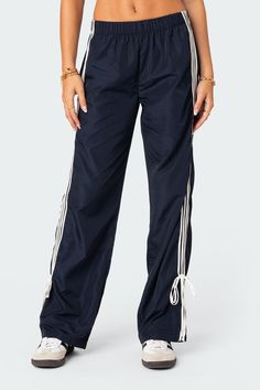 PRODUCT INFO Track pants Side stripe detailing Ribbon tie ankle detail Elastic waist Polyester Model wears size S Model height is 5'8 Item care: Wash with similar color 80s Y2k, Pants Jogger, Track Pants Women, Wide Leg Sweatpants, Pants Details, Low Rise Jeans, Leather Mini Skirts, Jogger Sweatpants, Knit Pants