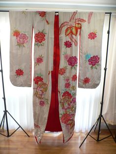 "A Stunning 1930's Japanese Uchikakke Wedding Kimono that is worn atop another kimono. quilted at the train bottom. Silk white background has Cranes, while the Gorgeous Embroidery depicts flower blossoms and treasure boxes done in Gold threads and beautiful bright colors. The inside is lined in red silk. The pictures do not do it justice ,you have to see it in real life to appreciate . It is a beauty. App.-70\" Long 50\" Wide with the sleeves. This is truly a Wearable Art from the past in very g Wedding Kimono With Floral Embroidery, Vintage Silk Kimono For Wedding, White Long Vintage Kimono, Long White Vintage Kimono, Vintage Kimono With Floral Embroidery, Vintage Red Kimono For Wedding, Vintage Long Kimono For Wedding, Traditional White Kimono With Floral Embroidery, Traditional Embroidered Kimono For Tea Ceremony