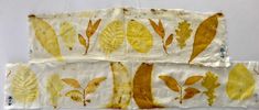 two pieces of fabric with yellow leaves on them