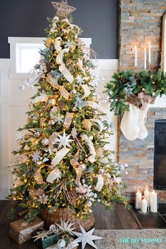 a decorated christmas tree in front of a fireplace