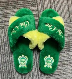 FUZZY CHI SLIPPERS!   These fuzzy house slippers are sure to  keep your toes warm and relaxed after a long day in the unit. Every nurse needs comfort and luxury.  These slippers offer comfort durability and would pair well with your chi eta phi pajamas!  Represent our organization and pair with your chi pajamas  at your  university's org pajama parties or in the comfort of your home. 🐢 💛💚 🐢 colors green and yellow 🐢 Shipped in TT&Co bag   🐢 Washing Instructions: -  not recommended.  🐢 3 s Comfortable Soft Indoor Slippers, Comfortable Green Slide Slippers, Comfortable Super Soft Indoor Slippers, Green Non-slip Slippers For Leisure, Comfy Super Soft Slippers For Leisure, Super Soft Slip-on Slippers For Indoor Use, Casual Indoor Slide Slippers, Comfy Round Toe Slippers For Home, Comfortable Round Toe Slippers For Relaxation