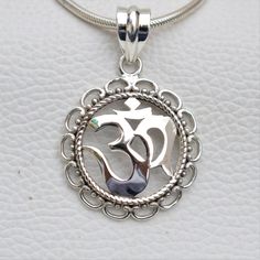 Metal-925 Sterling Silver This One of a kind Om Pendant Add this beautiful one little thing of galactic shine to make you feel unique and to transform your lives.Perfect for any kind of outfit and every occasion. About: 'OM' charms have their own significance. These jewelry pieces can be used for beautification and will also ensure financial as well as emotional satisfaction Wearing an 'OM' charm is said to bring harmony, peace and eternal bliss to the ones who wear them We accept custom and per Nickel Free Sterling Silver Pendant Charm Necklace, Adjustable Silver Charm Necklace For Gift, Silver Oval Pendant Charm Necklace In Sterling Silver, Silver Sterling Silver Oval Pendant Charm Necklaces, Silver Sterling Silver Charm Necklace With Oval Pendant, Spiritual Sterling Silver Necklace For Gift, Silver Round Pendant Necklace For Meditation, Handmade Sterling Silver Necklaces For Festivals, Symbolic 925 Silver Jewelry Gift