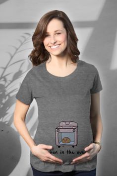 Celebrate the sweet expectation with our 'Bun in the Oven' maternity t-shirt! This funny shirt features a playful visual pun, making your pregnancy journey even more delightful. Crafted from super soft, high-quality ringspun cotton, it ensures lasting comfort beyond your baby bump's journey. With ruched sides and available in five sizes, fitting comfortably into this beauty is a breeze. Share the joy of your little bun with the world – order this maternity tee today! 🍞🤰 #MaternityFashion Happy Camper Tshirt, Camper Tshirt, Funny Maternity, Fall Shirts Women, Bun In The Oven, Western Graphic Tees, Maternity Shirt