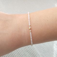 "Minimalist, wearable and delicate rose quartz and 14k gold filled beaded bracelet for everyday wearing. Length: from 5,5\" to 8\" with 2\" 14k gold filled extensor chain. Width: 2 mm 14k gold filled beads and rose quartz beads. Material: 14k gold filled strong lobster clasp. Handmade in Spain. ✩ Please kindly note that these stones are natural so they can vary slightly in color from the one on the pics. They can also contain some inclusions. ✩ Ideal for a gift to gold jewelry lovers. All our pr Minimalist Adjustable 14k Gold Filled Beaded Bracelets, Dainty Rose Gold Beaded Bracelets, Adjustable Minimalist Crystal Bracelet, Dainty White Rose Quartz Jewelry, Dainty Crystal Bracelet With Gemstone Beads For Everyday, Dainty 14k Gold-filled Bracelets With Gemstone Beads, Dainty Rose Quartz Round Beads Bracelets, Minimalist 14k Gold Filled Beaded Bracelets, Minimalist Crystal Bracelet Gift