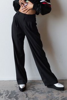 Meet your new favorite pants. Timeless and trendy are the Perfect Trouser featuring a loose fit with front pleat detail and side pockets. Color: Black Loose Fit Front Pleats Pockets Wide Leg Mid Rise Rayon Blend Model is 5'10", size 25/26 in bottoms and is wearing size small Classic Black Cargo Pants For Work, Wide Leg Dress Pants With Side Pockets For Work, Black Cargo Pants With Welt Pockets For Fall, Relaxed Fit Dress Pants With Side Pockets For Workwear, Formal Wide Leg Pants With Pockets And Relaxed Fit, Baggy Wide-leg Dress Pants For Workwear, Baggy Wide-leg Pants For Work, Classic Wide Leg Cargo Pants For Business Casual, Chic Relaxed Fit Cargo Pants For Work