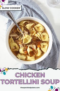 chicken tortellini soup in a white bowl on a blue and white striped towel