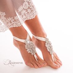 a close up of a person wearing barefoot sandals