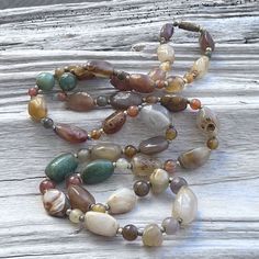 Vintage stone necklace condition- vintage, please look at pictures measures approximatly- Bohemian Beaded Agate Long Necklace, Bohemian Agate Beaded Long Necklace, Vintage Gemstone Beads Jewelry For Healing, Bohemian Long Agate Beaded Necklace, Vintage Gemstone Necklace For Healing, Bohemian Long Beaded Necklaces With Stones, Vintage Healing Gemstone Necklace, Bohemian Long Beaded Stone Necklace, Bohemian Beaded Necklaces For Healing