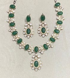 Polki Necklace Set features emerald green Kundan stones with a Sabyasachi-inspired design. Adorned with moissanite and Polki diamonds, it showcases intricate craftsmanship and elegant statement-making. Perfect for weddings, this piece blends traditional Indian artistry with contemporary sparkle, offering a stunning focal point for any bridal ensemble. *𝐏𝐑𝐎𝐃𝐔𝐂𝐓 𝐃𝐄𝐓𝐀𝐈𝐋* * Material: Brass * Plating: Gold Plated * Stone: Semi Precious Kundan & Polki. *𝐃𝐈𝐌𝐄𝐍𝐒𝐈𝐎𝐍𝐒* *  Necklace- Elegant Green Kundan Necklace With Meenakari, Traditional Emerald Kundan Necklace For Formal Occasions, Formal Kundan Necklace For Diwali, Emerald Kundan Necklace With Intricate Design For Festive Occasions, Elegant Kundan Necklace With Emerald Stone Work, Festive Emerald Kundan Necklace With Intricate Design, Festive Kundan Emerald Necklace For Receptions, Elegant Emerald Kundan Necklace With Stone Work, Elegant Kundan Emerald Necklace For Festive Occasions