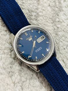 Vintage Seiko 5 Automatic Blue Dial Movement No.6119-8430 21Jewels Day/Date Men's Wrist Watch Seller Notes:"PLEASE NOTE: CHECK THE SIZE OF THE WATCH BEFORE BUY IT NOW. OUR WATCHES Are VINTAGE SO IT MAY RUN 3-5 MINUTES FAST OR SLOW IN 24 HOURS, WE TRY to KEEP IT AS ACCURATE AS POSSIBLE." Item specifics Condition:Pre-owned  Brand:Seiko Movement:Mechanical (Automatic)  Year of Manufacture:1970-1980 Band Material:Nylon Case Material:Stainless Steel Water Resistance:Water Resistant Features: 12-Hour Dial, Day/Date Model:Seiko 5 Case Color:Silver Case Size:39mm Age Group:Adult Face Color: Blue Band Color: Blue ( 20mm) Display:Analog Number of Jewels:21 Jewels Lug Width:19mm Gender:Men's Country/Region of Manufacture:Japan Watch Shape:Round Style:Antique, Casual, Vintage Case Finish:Polished Band Blue Dial Watch, Seiko 5 Automatic, Seiko 5, Blue Band, Wristwatch Men, Steel Water, Gift For Him, Favorite Jewelry, Gifts For Him