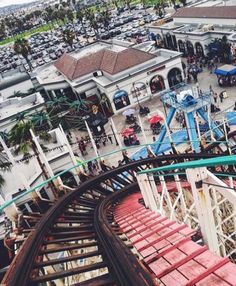 an aerial view of a roller coaster at a theme park