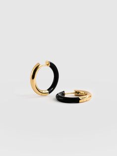 Enamel Hoop Earrings - Gold/Black Luxury Classic Black Enamel Jewelry, Luxury Yellow Gold Enamel Hoop Earrings, Luxury Statement Black Enamel Earrings, Trendy Yellow Gold Enamel Jewelry, Modern Black Small Hoop Jewelry, Modern Everyday Enamel Jewelry, Trendy Black Hoop Jewelry, Modern Black Hoop Jewelry, Gold Enamel Hoop Jewelry